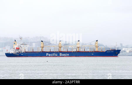 Oakland, CA - March 03, 2019: Pacific Basin bulk carrier LONGVIEW LOGGER anchored in the San Francisco Bay. Bulk carriers today are specially designed Stock Photo