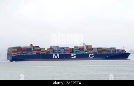 Oakland, CA - March 03, 2019: MSC LAURENCE anchored in the San Francisco Bay on a foggy day. Mediterranean Shipping Company (MSC) is the worlds 2nd la Stock Photo