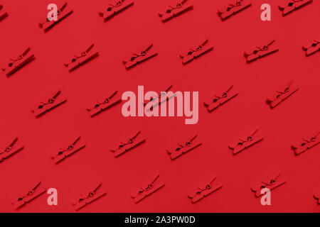 Monochrome pattern with repetitive clothes pins. Horizontal Stock Photo