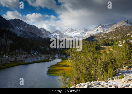 Little Lakes Valley hiking trail with the mighty  Eastern Sierra Nevada Mountains rising high in the background. California USA. Stock Photo