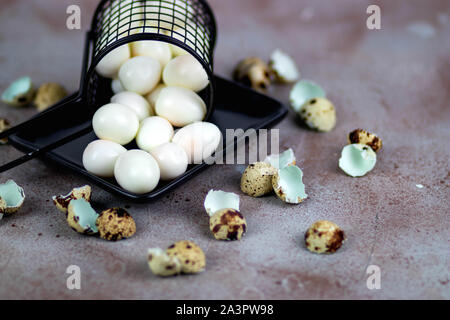 Quail eggs in a basket Stock Photo
