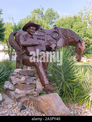 Statue of Tex Ritter, an early singing cowboy, outside the Texas Country Music Hall of Fame and Tex Ritter Museum in Carthage, Texas Stock Photo