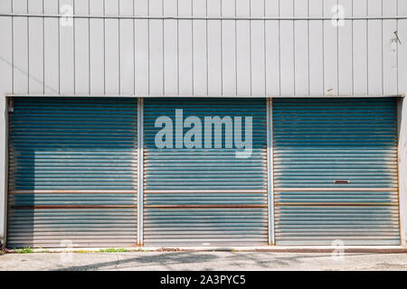 Closed metal shutter door of building Stock Photo