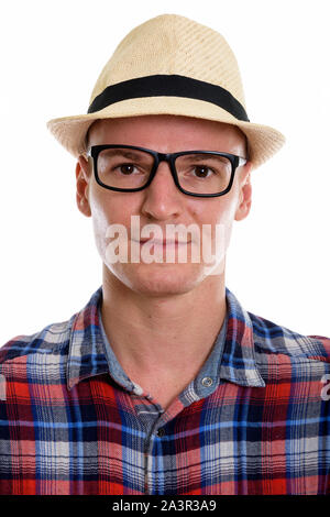 Face of young handsome man wearing eyeglasses and hat Stock Photo
