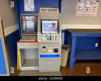 Orlando,FL/USA-10/7/19:  A self service postage machine in an United States Postal Service, USPS, office next to an international airport in the city Stock Photo