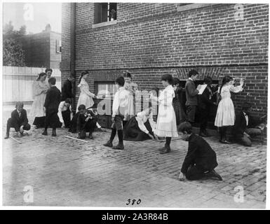 Students of 8th Division school using rulers, yardsticks, and measuring tape in school yard, Washington, D.C. Stock Photo