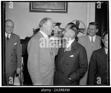 Study plan for early independence of Philippines. Washington, D.C., April 19. Assistant Secretary of State Francis B. Sayre, (left) and Manuel Quezon, President of the Philippines, pictured as they attended the initial session of a joint conference of American and Philippine experts to survey the economic readiness of the commonwealth for independence at early date. The Committee, meeting at the State Department, will prepare a report to an Interdepartmental Committee for consideration by President Roosevelt, 4/19/1937 Stock Photo