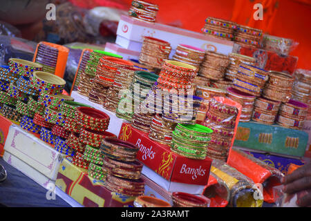 ornaments bangles chains silver gold caps shop outdoor jewelry, on the road side store in india Stock Photo