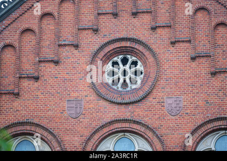 an old seti  red facade with beautiful patterned glass windows Stock Photo