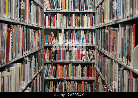 Los Angeles, CA / USA - Sept. 29, 2019: Many English language books are shown organized on metal shelves in a public library. For editorial uses only. Stock Photo
