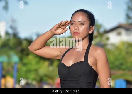 An Adult Female Saluting Stock Photo