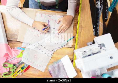 woman working on patterns and designs view from above Stock Photo