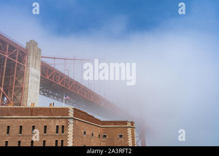 Golden Gate Bridge and Fort Point in the fog Stock Photo