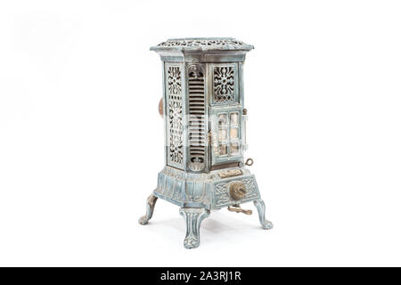 Old vintage wood burning heater stove. Isolated on white. Stock Photo