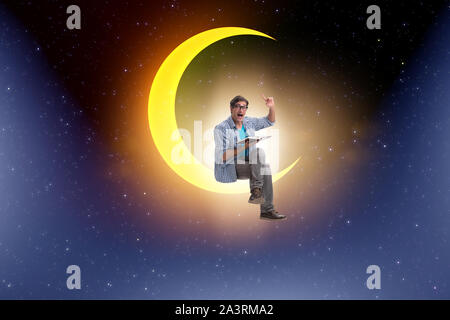 The student reading book on the moon crescent Stock Photo