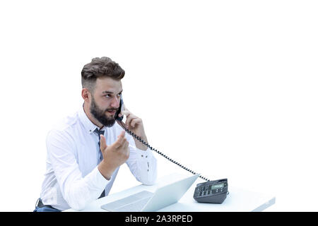 young guy businessman talking on the phone. Explains, makes hand gestures. bearded hipster free worker. remote workplace in nature Stock Photo