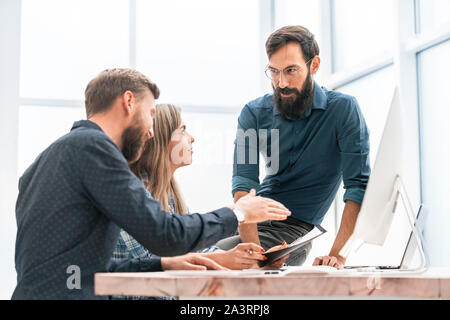 colleagues extending their hands to each other for a handshake Stock Photo