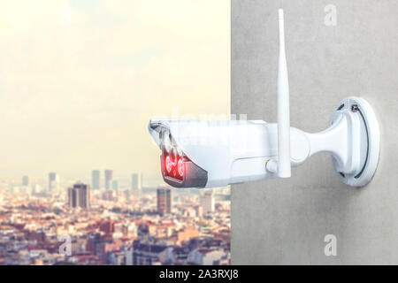 detail of a surveillance camera with infrared technology for night vision and wireless connection. City in the background. Security concept. Stock Photo