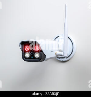 detail of a surveillance camera with infrared technology for night vision and wireless connection on a white background. Stock Photo