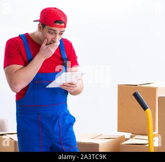 The contractor worker moving boxes during office move Stock Photo