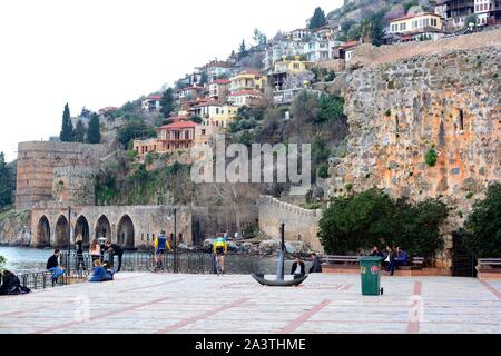Alanya Harbour in early Spring before the new season starts. Boats are being refurbed & lovers attach locks to the harbour barriers to show their love Stock Photo
