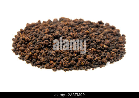 Black granulated tea on a white background Stock Photo