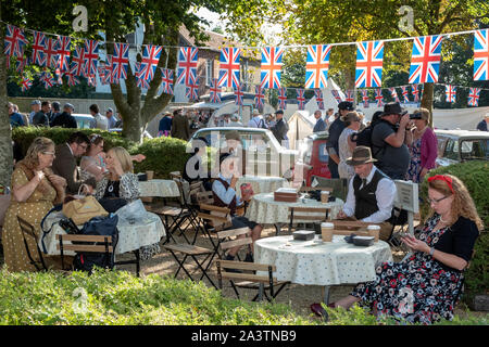A scene from the Goodwood Revival, a unique spectacle of lifestyle,fashion, motoring and fun from the 1940s 1950's and 1960s Stock Photo