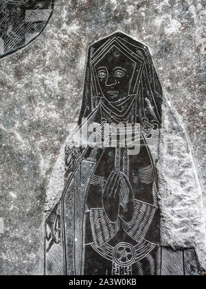 Incised slate of a medieval lady at prayer set into the floor of Norbury parish church near Shbourne in Derbyshire UK Stock Photo