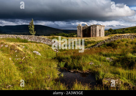 Hermitage Castle is a semi-ruined castle in the Scottish Borders, and has a reputation as one of the most sinister and atmospheric in Scotland. Stock Photo