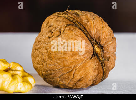 Walnuts on wooden background, nut in shell Stock Photo