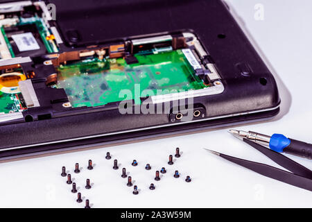 Computer circuit board and fix word made of screws Stock Photo