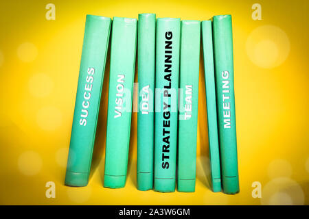 Strategy Planning, with relevant words on the spine of books.  Stock Photo