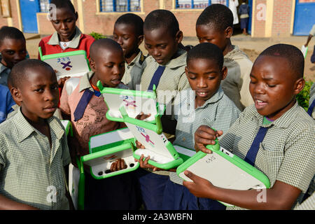 RWANDA, Ruhengeri, Initiative One laptop per child OLPC founded by Nicholas Negroponte, children using a XO laptop at Primary school - digitalization Stock Photo