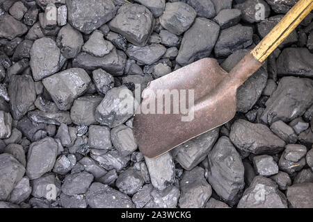 Coal industry, coal in a warehouse with a shovel Stock Photo
