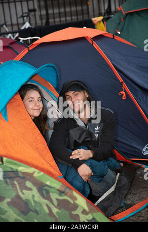 London, UK. 9th October 2019. Protesters camping and waking up on the road near Nelson Column, Trafalgar Square, during the Extinction Rebellion two week long protest in London. Credit: Joe Kuis / Alamy News Stock Photo