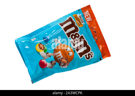Packet of salted caramel M&Ms sweets candies isolated on white