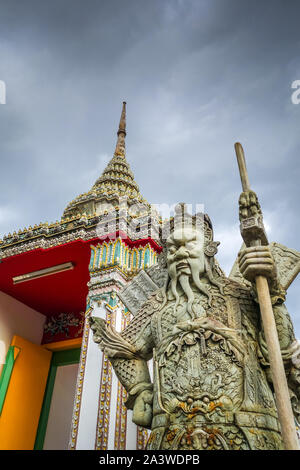 Chinese Guard statue in Wat Pho Buddhist temple, Bangkok, Thailand Stock Photo