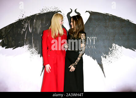 Elle Fanning (left) and Angelina Jolie during the Maleficent: Mistress of Evil Photocall at the Mandarin Oriental hotel in London. Stock Photo