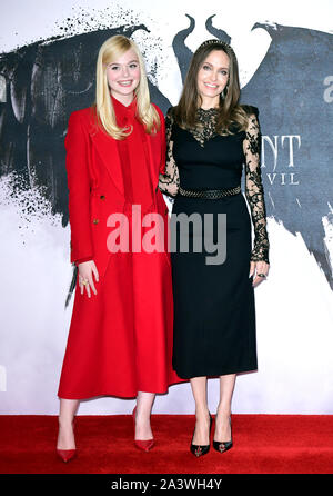 Elle Fanning (left) and Angelina Jolie during the Maleficent: Mistress of Evil Photocall at the Mandarin Oriental hotel in London. Stock Photo