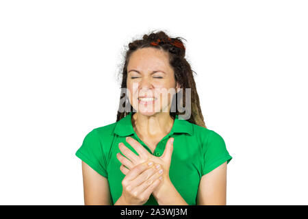 Woman suffering from hand pain. A woman massaging her painful hand. Acute pain in wrist. Stock Photo