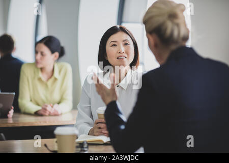 Colleagues having a casual business meeting Stock Photo