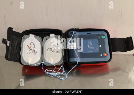 Automated external defibrillator opened up showing the 2 chest pads Stock Photo