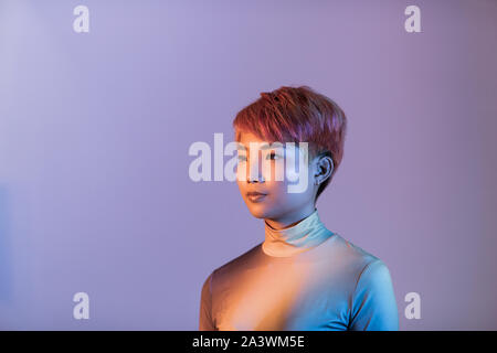 Creative shot of futuristic asian young adult Stock Photo