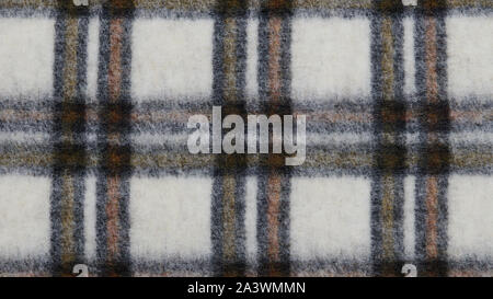 Multicolored checked coat closeup. Woolen clothes. Checkered background. Soft and warm natural material. Wide format photo. Stock Photo