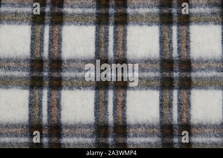 Multicolored checked coat closeup. Woolen clothes. Checkered background. Soft and warm natural material. Stock Photo