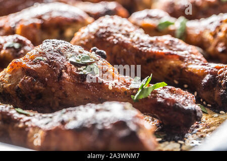 Roasted chicken legs barbecue on baked paper - Close-up Stock Photo