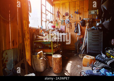 Workshop, shed, garage or storage room with tools for repair, chores, spare parts from various equipment Stock Photo