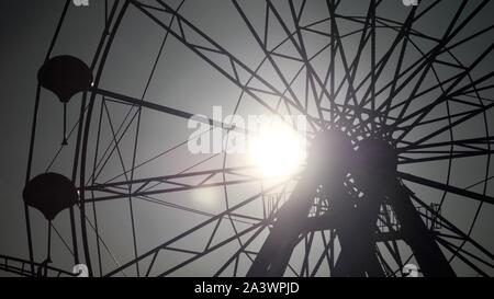 Codona's Grampian Eye Ferris Wheel, Silhouetted Abstract, During the Winter Off Season. Aberdeen, Scotland, UK. Stock Photo