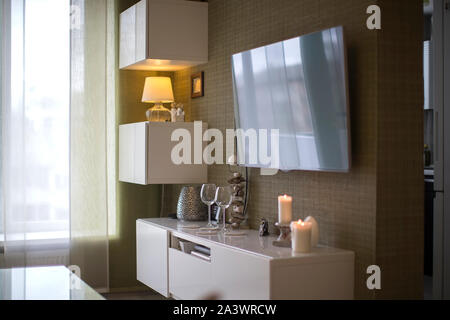 Apartment in a panel house. Interior living room with TV. Fragment of an ordinary apartment Stock Photo