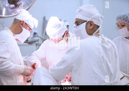 City Gomel, Belarus. June 01, 2017 City Hospital. Doctors in the operating room do the surgery. Surgeons operate on a patient. Medical professionals t Stock Photo